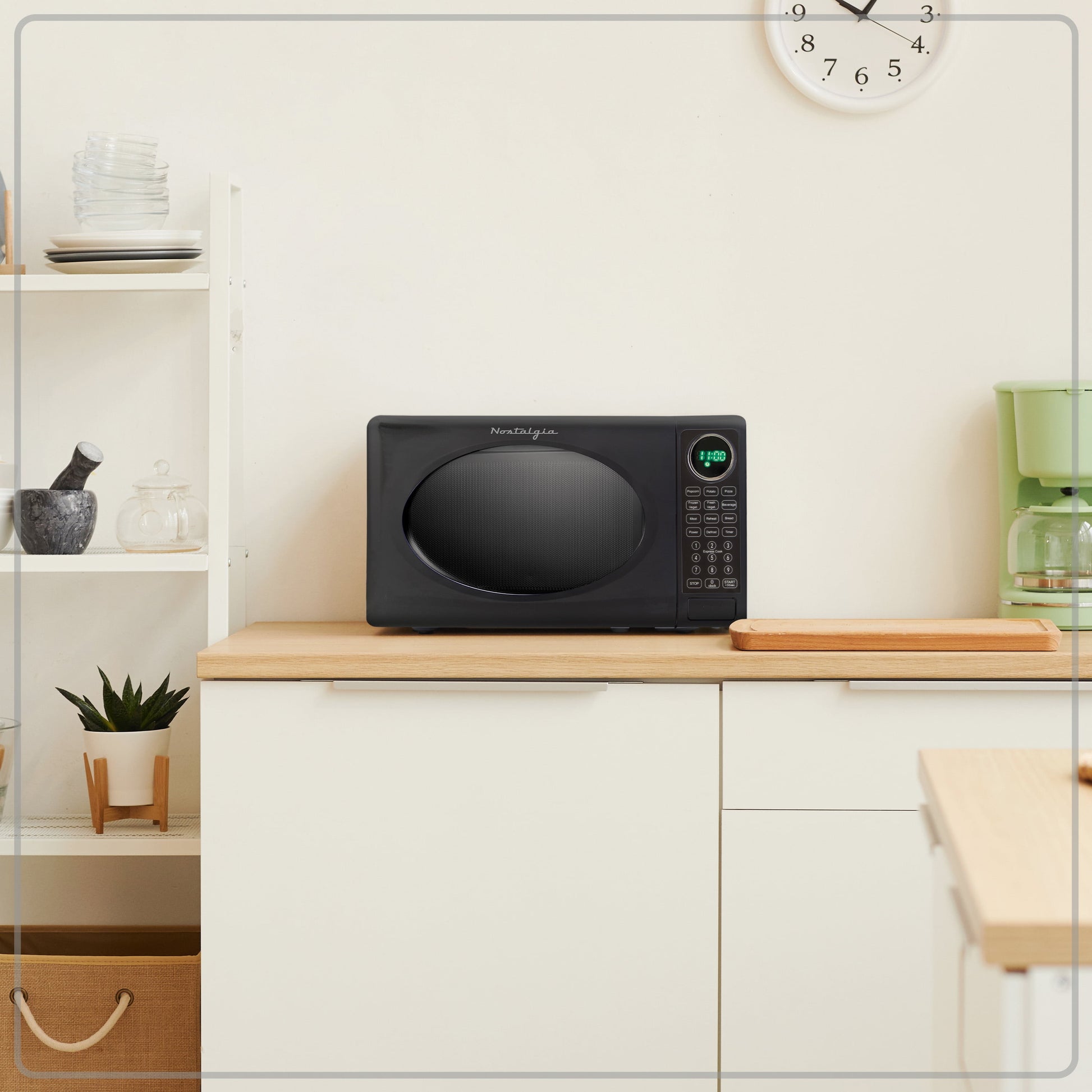 Nostalgia 0.7 Cu. ft. Modern Retro Set Countertop Microwave Oven in Black